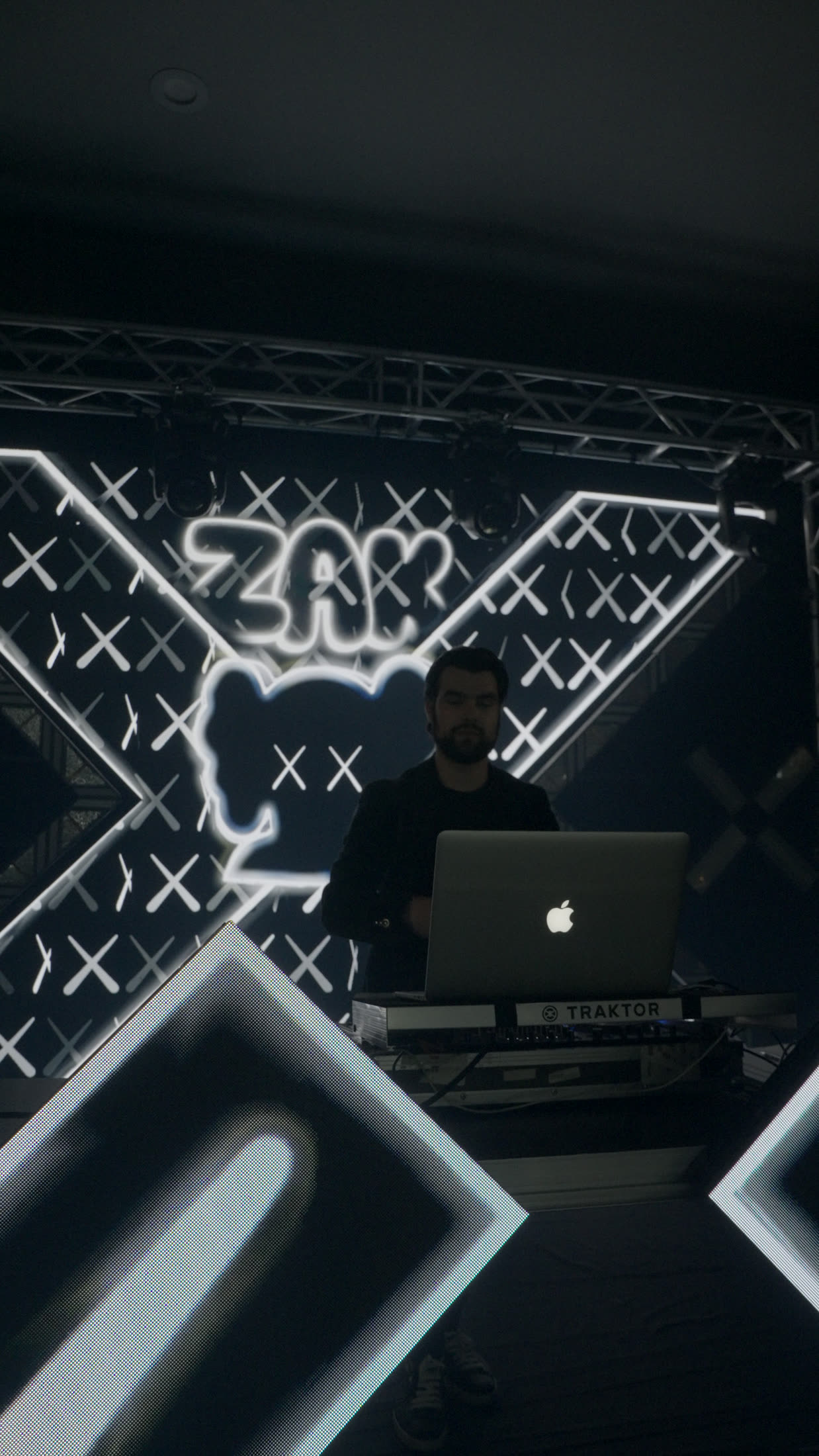 Laser-lit stage with neon marquee