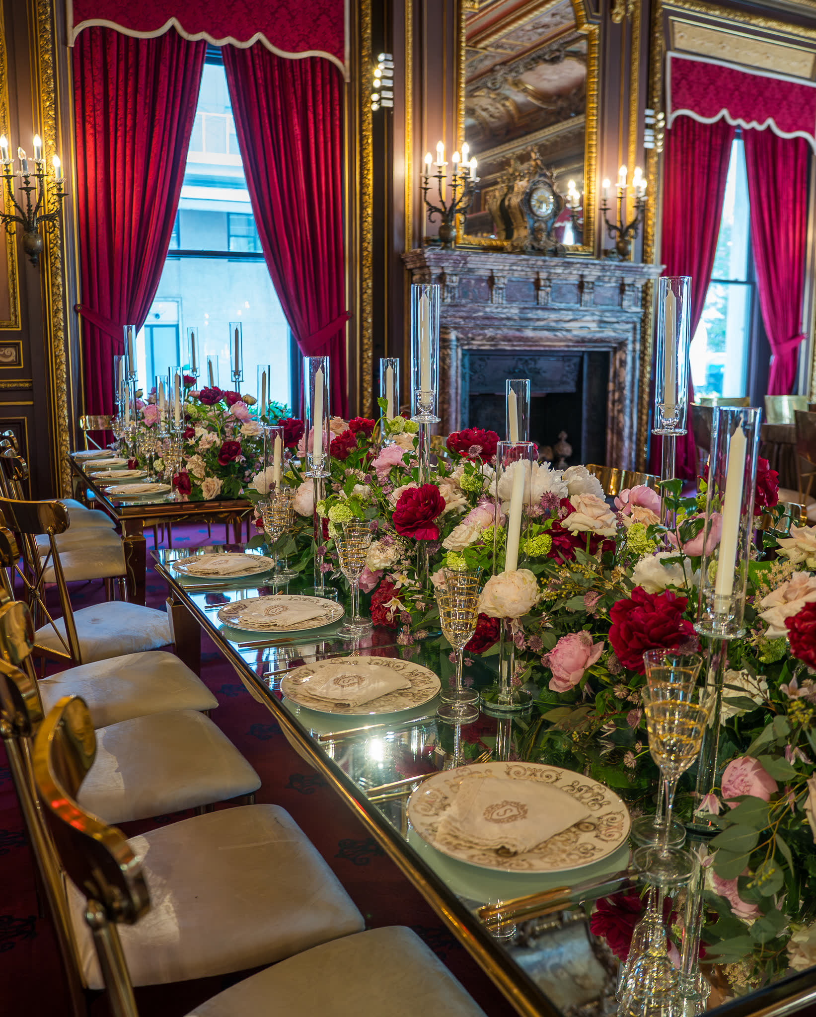 Banquet table with black candelabra in a marble stair hall